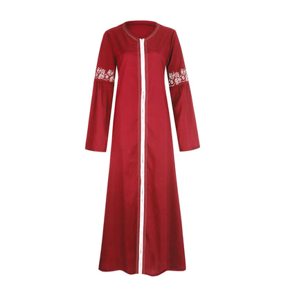Bold red floral abaya for women displayed on hanger, modest fashion with soft fabric and floral print for Muslim women’s clothing collections.