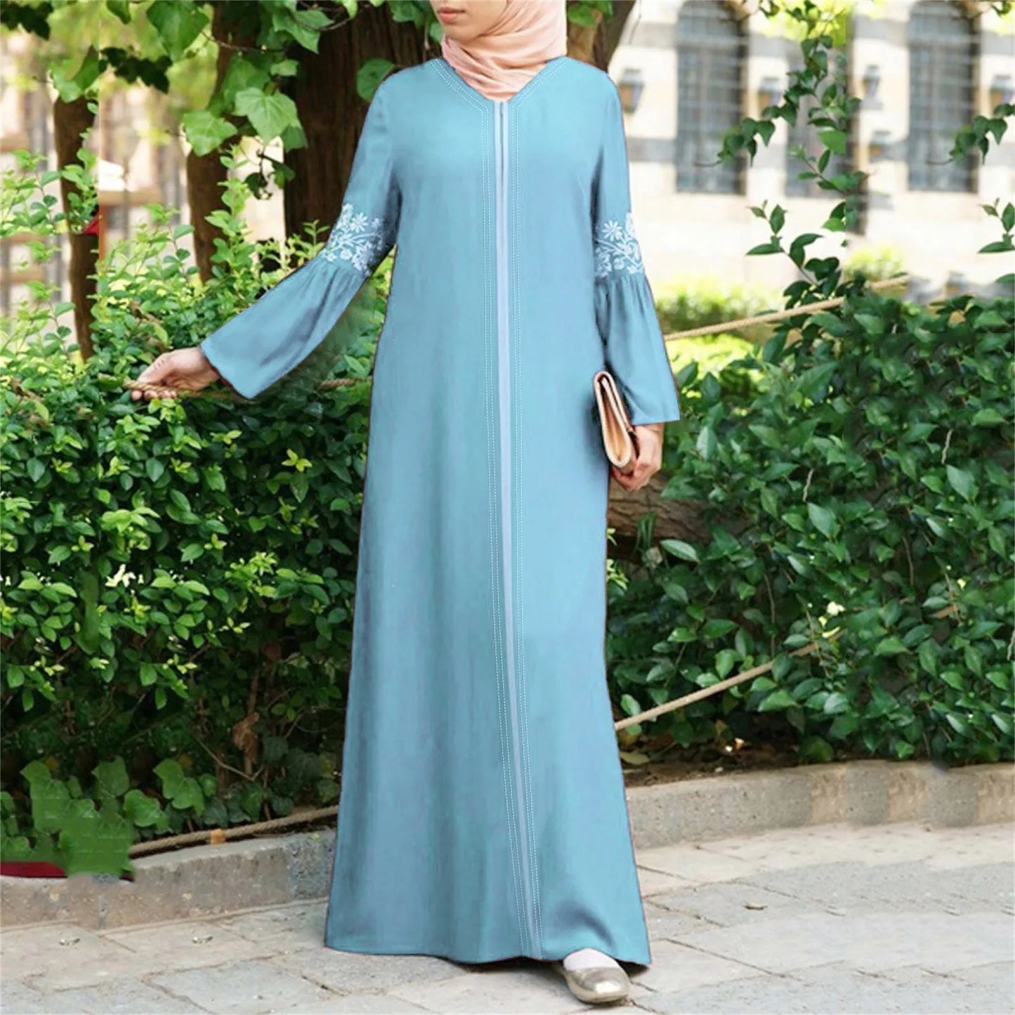 Elegant light blue floral abaya for women with full-length modest design, perfect for everyday wear or formal occasions.